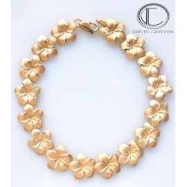 Bracelet Hibiscus.Or 750/1000 BRACELET  14 HIBISCUS Longueur : 22cm...