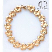 Bracelet Hibiscus.Or 750/1000 BRACELET  14 HIBISCUS Longueur : 22cm...