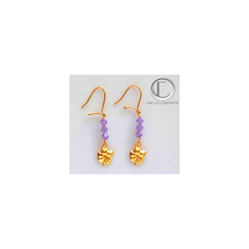 Boucles d oreilles hibiscus.Or 750/1000