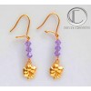 Boucles d oreilles hibiscus.Or 750/1000