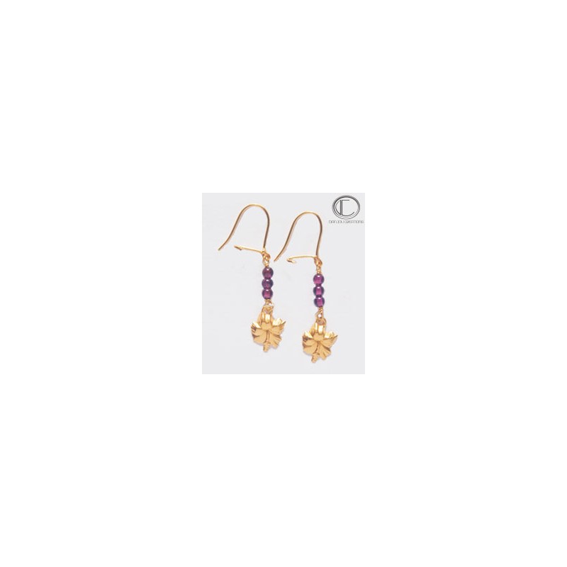 Boucles d oreilles hibiscus.Or 750/1000