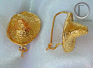 Boucles d'oreilles bakoua.Or 750/1000