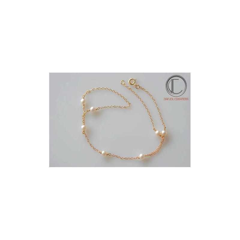 Bracelet main  perle fine.Or750/100