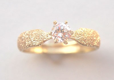 BAGUE  STELLA.Or 750/1000.